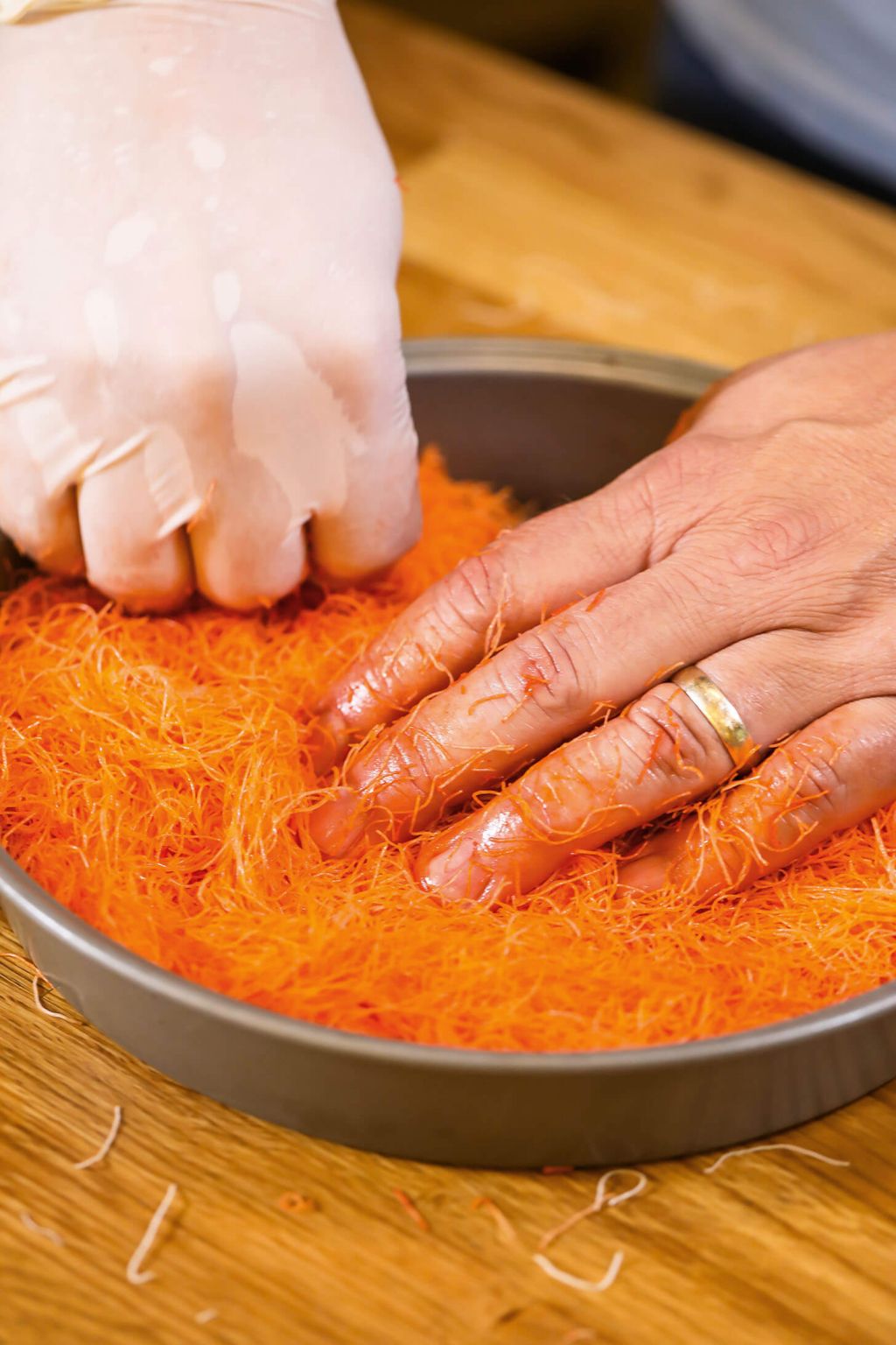 pressing down dough